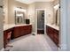 Dual vanities create an open and functional bathroom with a view into another room of the house at 880 Craigmont Nw Ln, Concord, NC 28027