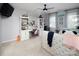Well-lit bedroom with carpet, built-in bookcases, desk area, and soft natural light at 880 Craigmont Nw Ln, Concord, NC 28027