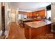 Kitchen with custom cabinets, granite countertops, large island, and stainless appliances at 880 Craigmont Nw Ln, Concord, NC 28027