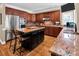 Kitchen features custom cabinets, granite countertops, large island, and stainless appliances at 880 Craigmont Nw Ln, Concord, NC 28027