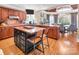 Eat-in kitchen features custom cabinets, granite countertops, large island, and stainless appliances at 880 Craigmont Nw Ln, Concord, NC 28027