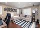 Comfortable living room with modern decor, and stylish striped area rug at 880 Craigmont Nw Ln, Concord, NC 28027