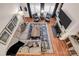 Aerial view of the living room featuring a fireplace, hardwood floors, and comfortable seating at 880 Craigmont Nw Ln, Concord, NC 28027