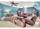 Bright living room with vaulted ceilings, large sectional, and colorful rug provides comfort at 880 Craigmont Nw Ln, Concord, NC 28027