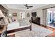 Spacious main bedroom features a ceiling fan, hardwood floors, and access to private balcony at 880 Craigmont Nw Ln, Concord, NC 28027