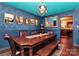 Elegant dining room featuring a dark wood table and bench, with an elaborate chandelier at 9200 Surrey Rd, Mint Hill, NC 28227