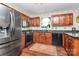 Well-equipped kitchen with stainless steel appliances and dark granite countertops, ready for culinary adventures at 9200 Surrey Rd, Mint Hill, NC 28227