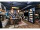 Cozy living room with a brick fireplace, built-in bookshelves, and a comfortable leather couch beneath a paneled ceiling at 9200 Surrey Rd, Mint Hill, NC 28227
