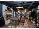 Inviting living room features a brick fireplace, bookshelves, a comfortable couch, and a unique paneled ceiling at 9200 Surrey Rd, Mint Hill, NC 28227