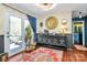 Bright sitting room with an antique sideboard, a doorway to another room, and an exit to the rear deck at 9200 Surrey Rd, Mint Hill, NC 28227