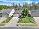 Inviting single-story home with lush green lawn, attached garage, and close proximity to neighboring houses at 9209 Tibble Creek Way, Charlotte, NC 28227