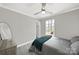 Bedroom featuring wood-look flooring and a large window overlooking the backyard at 9209 Tibble Creek Way, Charlotte, NC 28227