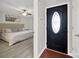 An inviting front entrance featuring a decorative door that leads into a bedroom area at 9209 Tibble Creek Way, Charlotte, NC 28227