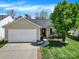 Charming single-story home with a well-maintained lawn and attached two-car garage at 9209 Tibble Creek Way, Charlotte, NC 28227