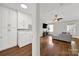 Open concept living area with hardwood floors, a ceiling fan, and plenty of natural light at 9209 Tibble Creek Way, Charlotte, NC 28227