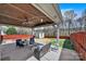 Backyard patio features an outdoor seating area, shed, and a fenced in yard at 9209 Tibble Creek Way, Charlotte, NC 28227