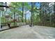 Spacious backyard with seating around a firepit and mature trees at 110 Sonnys Way, Fort Mill, SC 29708