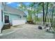 Beautiful backyard with a garage, basketball hoop, fire pit, and outdoor seating at 110 Sonnys Way, Fort Mill, SC 29708