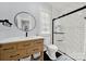 Well-lit bathroom featuring a modern shower and wooden vanity at 110 Sonnys Way, Fort Mill, SC 29708