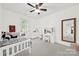 A charming bedroom features a plush bed, vanity, and ample natural light from the window at 110 Sonnys Way, Fort Mill, SC 29708