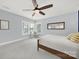 Bright bedroom with large windows, ceiling fan, and a peaceful ambiance at 110 Sonnys Way, Fort Mill, SC 29708