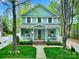 Charming two-story home with a inviting front porch, lush lawn, and traditional architectural details at 110 Sonnys Way, Fort Mill, SC 29708
