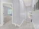 An upstairs hallway with carpeted flooring, and plenty of light at 110 Sonnys Way, Fort Mill, SC 29708