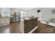 Kitchen featuring stainless steel appliances, granite countertops, and a stone-clad breakfast bar at 110 Sonnys Way, Fort Mill, SC 29708