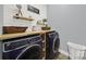 Convenient laundry room with wood countertops and modern washer and dryer at 110 Sonnys Way, Fort Mill, SC 29708