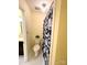 A well-lit bathroom features a floral shower curtain and a white tiled floor at 1101 E Morehead St # 31, Charlotte, NC 28204