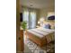 Bright bedroom with a modern bed, light wood accents, large window, and stylish decor for a serene retreat at 1101 E Morehead St # 31, Charlotte, NC 28204