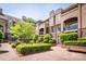 Attractive condominium community with a lush courtyard featuring manicured landscaping at 1101 E Morehead St # 31, Charlotte, NC 28204