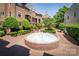 Charming courtyard with a water fountain and well-manicured landscaping at 1101 E Morehead St # 31, Charlotte, NC 28204