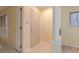 Inviting entryway with a white door, marble floors, white trim, and column detail at 1101 E Morehead St # 31, Charlotte, NC 28204