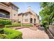Beautiful multi-level townhome with brick accents, manicured hedges and a spacious brick courtyard at 1101 E Morehead St # 31, Charlotte, NC 28204
