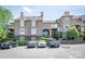 Well-maintained townhome exterior with parking spaces and manicured greenery at 1101 E Morehead St # 31, Charlotte, NC 28204
