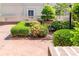 Landscaped garden beds with lush hedges and flowering azaleas are perfectly manicured and maintained at 1101 E Morehead St # 31, Charlotte, NC 28204