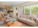 Open-concept living area with dining space, sliding glass doors to a patio, and neutral decor at 1101 E Morehead St # 31, Charlotte, NC 28204
