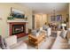 Bright living room with fireplace, comfortable seating, and adjacent dining area at 1101 E Morehead St # 31, Charlotte, NC 28204