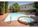 Community pool and hot tub with plenty of seating and common area space at 1101 E Morehead St # 31, Charlotte, NC 28204