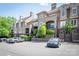 Street view of a well-maintained condominium complex with parking and manicured landscaping at 1101 E Morehead St # 31, Charlotte, NC 28204