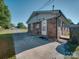 The rear of the brick home features an entrance with a concrete pad for easy access at 1108 Pearson Dr, Rock Hill, SC 29730