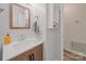 Updated bathroom with a decorative mirror, a wood vanity, and stylish tile accents at 1108 Pearson Dr, Rock Hill, SC 29730