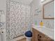 Relaxing bathroom with vanity, fresh towels, and shower showcasing a floral curtain at 1108 Pearson Dr, Rock Hill, SC 29730