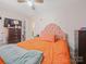 Bright bedroom featuring a plush bed with stylish headboard, ceiling fan, and neutral walls at 1108 Pearson Dr, Rock Hill, SC 29730