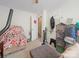 Spacious bedroom featuring a bed with colorful bedding and decor and doorway into an adjacent room at 1108 Pearson Dr, Rock Hill, SC 29730