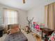 Versatile room with home gym equipment, a comfortable daybed, and natural light for fitness or relaxation at 1108 Pearson Dr, Rock Hill, SC 29730