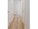 Bright hallway with wood-look floors connecting various rooms and featuring white trim at 1108 Pearson Dr, Rock Hill, SC 29730