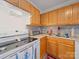 Functional kitchen featuring light wood cabinets, modern appliances, and a tiled backsplash at 1108 Pearson Dr, Rock Hill, SC 29730