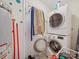 Functional laundry room featuring a stacked washer and dryer set and water heater at 1108 Pearson Dr, Rock Hill, SC 29730